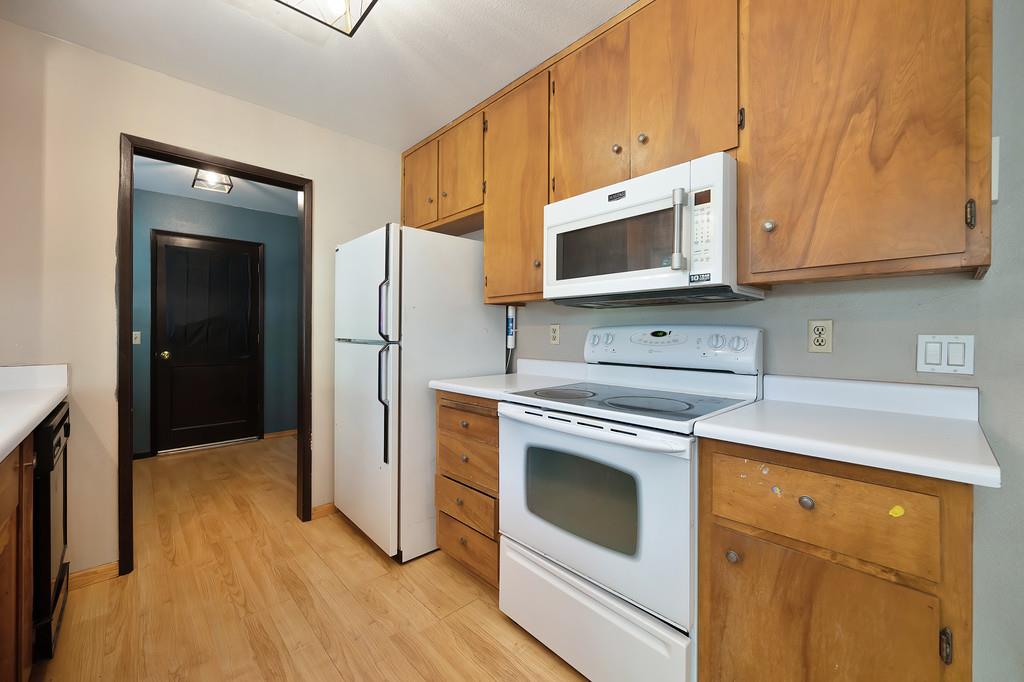 2917 Shadow Lane Pollock Pines, CA 95726 - Photo 11 of 29 a kitchen with stainless steel appliances granite countertop a stove a microwave and a refrigerator