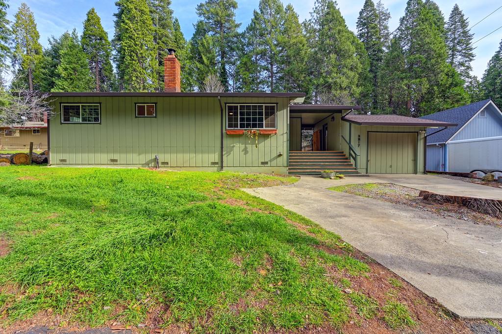 2917 Shadow Lane Pollock Pines, CA 95726 - Photo 2 of 29 a view of a house with backyard and garden