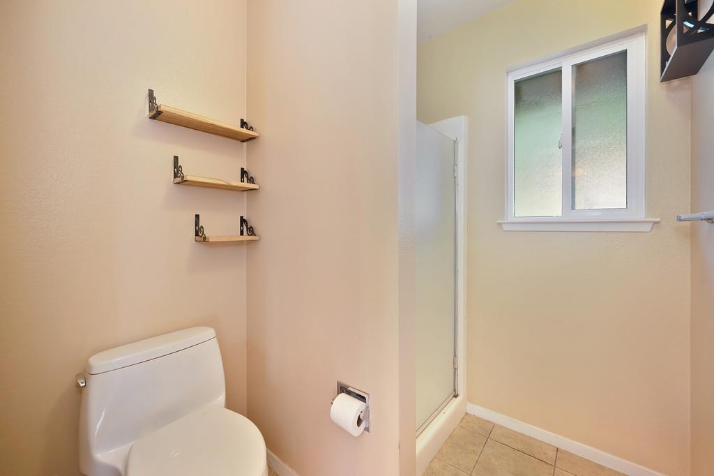 2917 Shadow Lane Pollock Pines, CA 95726 - Photo 21 of 29 a white toilet sitting next to a bathroom sink