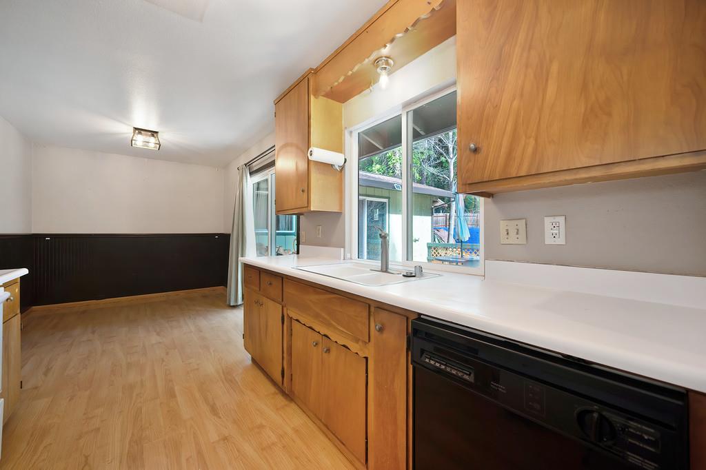 2917 Shadow Lane Pollock Pines, CA 95726 - Photo 9 of 29 a kitchen with stainless steel appliances a sink and a stove