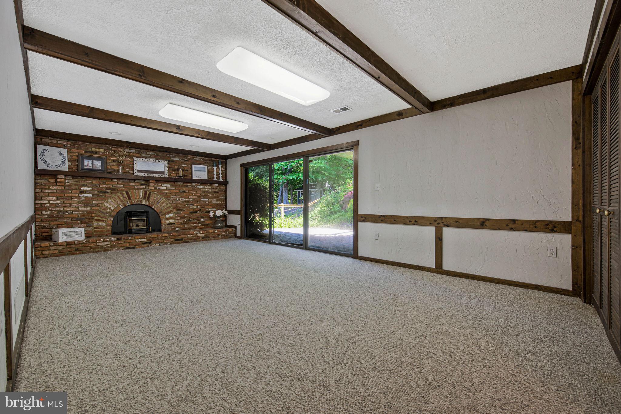 446 Kingwood Road Linthicum Heights, MD 21090 - Photo 34 of 46 Beautiful brick fireplace with a pellet stove