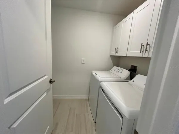 a view of room with window and ceiling fan