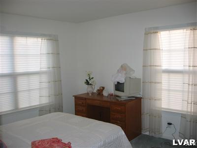 106 Bethpage Terrace Easton, PA 18042 - Photo 12 of 21 a bedroom with a bed and window