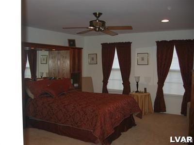 106 Bethpage Terrace Easton, PA 18042 - Photo 14 of 21 a bedroom with a bed and a large mirror