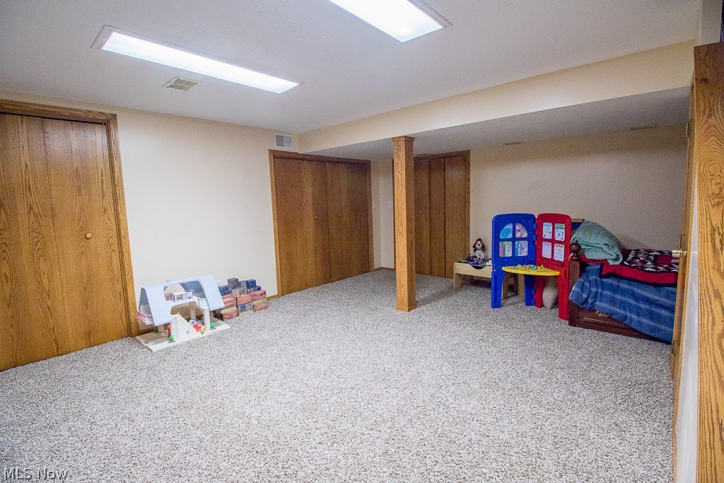 7750 Garfield Road Mentor, OH 44060 - Photo 22 of 26 Partially finished basement with lots of storage space and laundry.