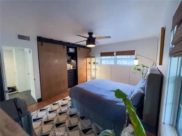 a bedroom with furniture and a chandelier