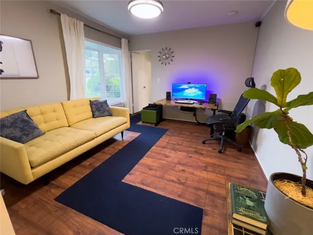 a living room with furniture rug and window