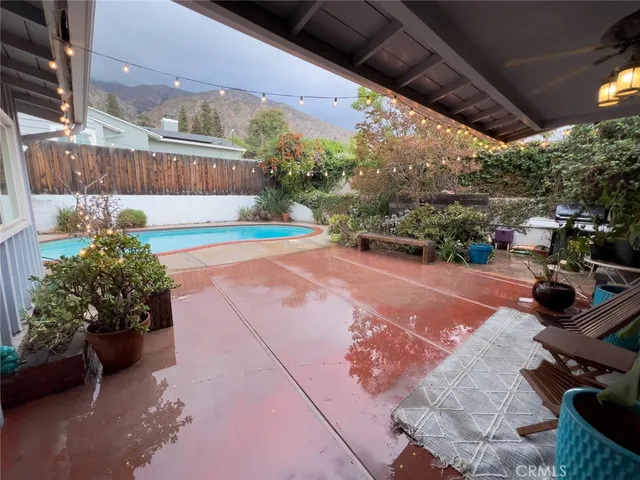 a view of a backyard with sitting area