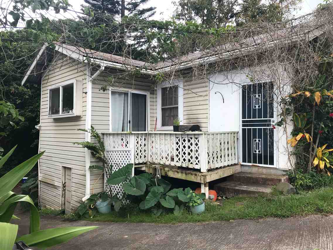 15 Olinda Road Makawao, HI 96768 - Photo 16 of 18 a view of a house with a yard chairs and wooden fence