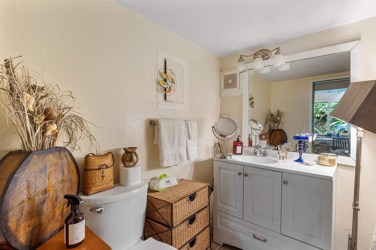 15 Olinda Road Makawao, HI 96768 - Photo 6 of 18 a en suite bathroom with a sink mirror and vanity
