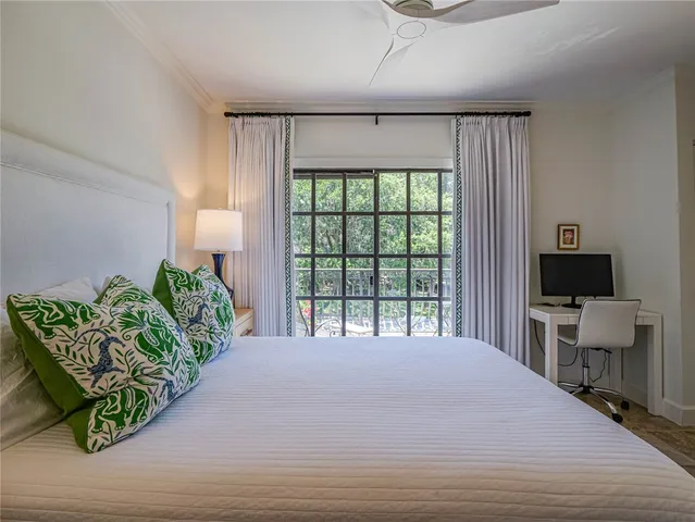 a bedroom with furniture and a window