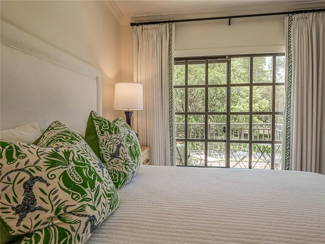 a bed room with a bed and a window