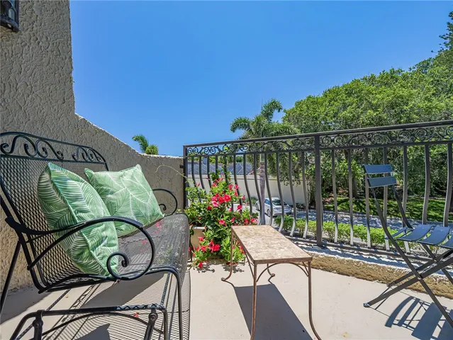 a view of a chairs and table in patio