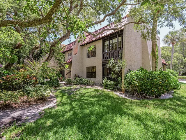 a sign that is sitting in front of a house