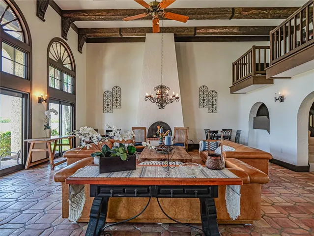 a living room with fireplace furniture and a window