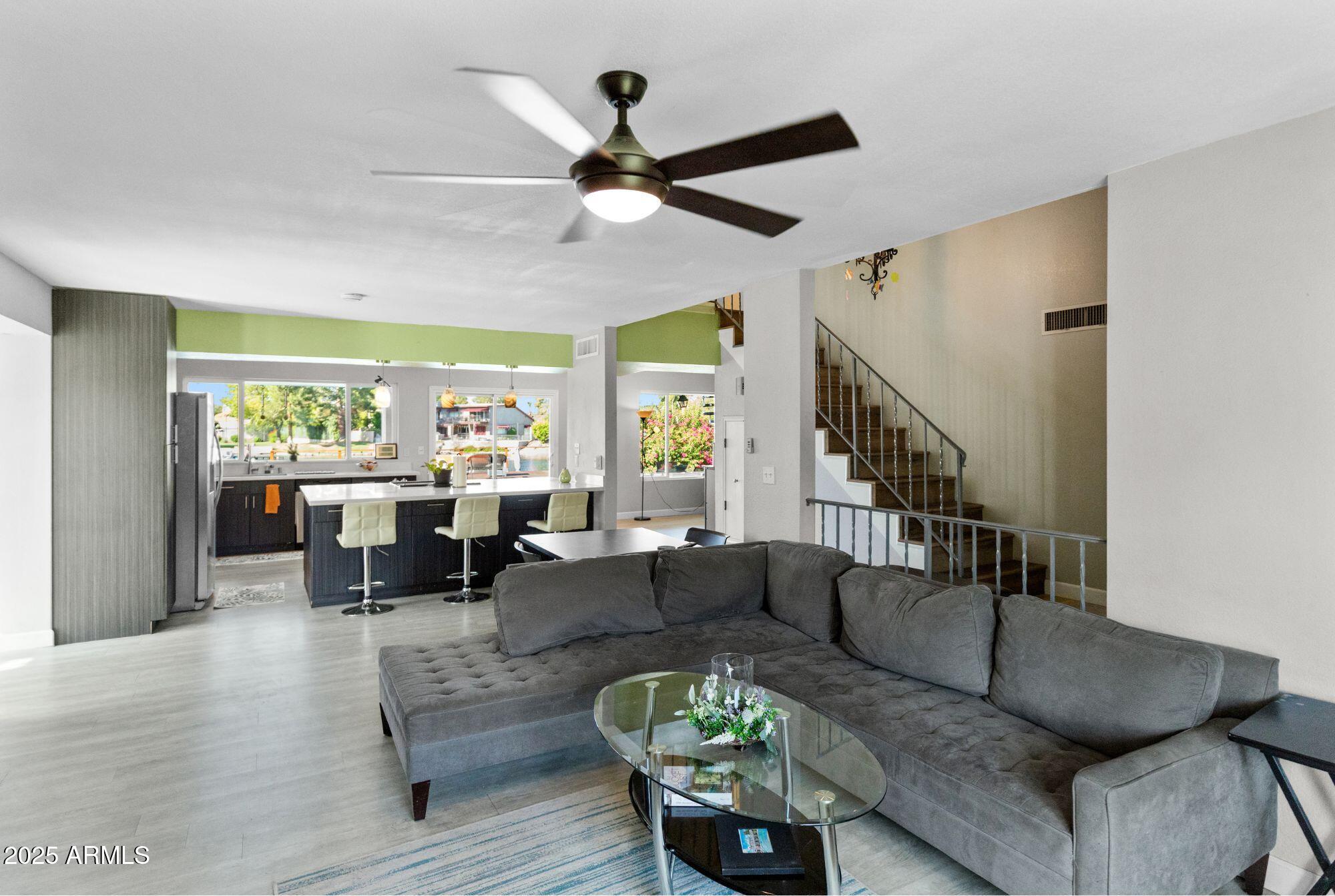 1210 East Harbor View Drive Tempe, AZ 85283 - Photo 14 of 68 a living room with fireplace furniture and a large window