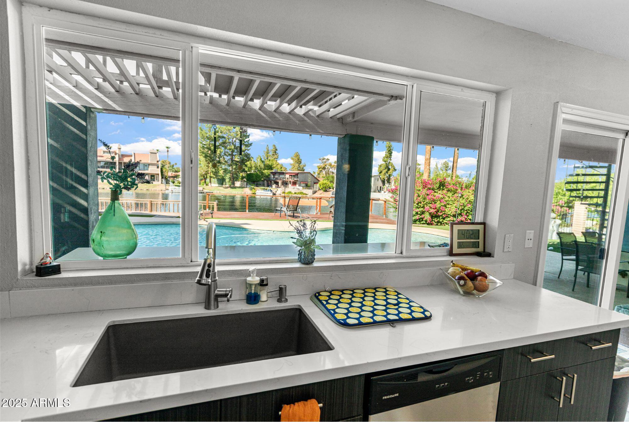 1210 East Harbor View Drive Tempe, AZ 85283 - Photo 19 of 68 a view of a sink and a window in a kitchen