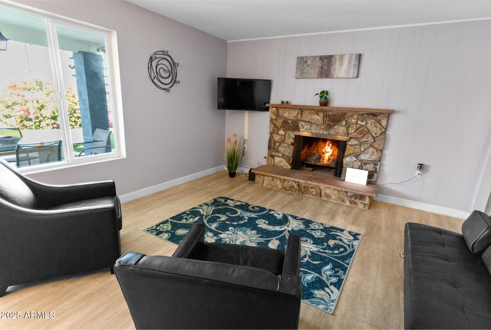 1210 East Harbor View Drive Tempe, AZ 85283 - Photo 24 of 68 a living room with furniture and a fireplace