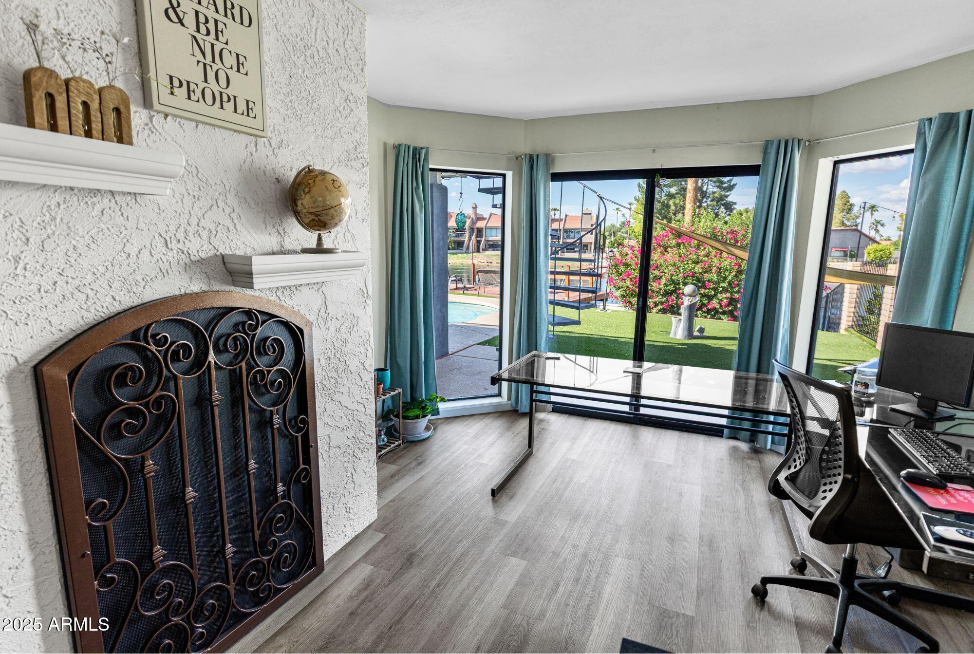 1210 East Harbor View Drive Tempe, AZ 85283 - Photo 28 of 68 a view of a livingroom with wooden floor and furniture