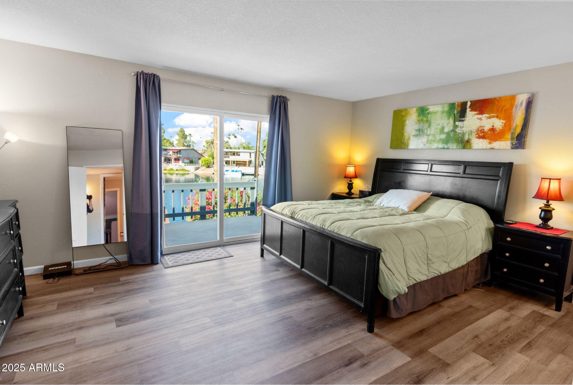 1210 East Harbor View Drive Tempe, AZ 85283 - Photo 37 of 68 a bedroom with a bed and large windows