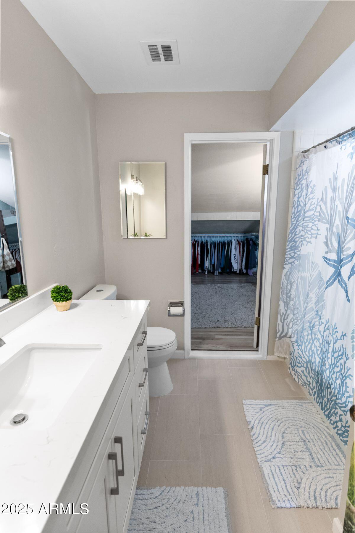 1210 East Harbor View Drive Tempe, AZ 85283 - Photo 39 of 68 a bathroom with a sink a toilet and shower