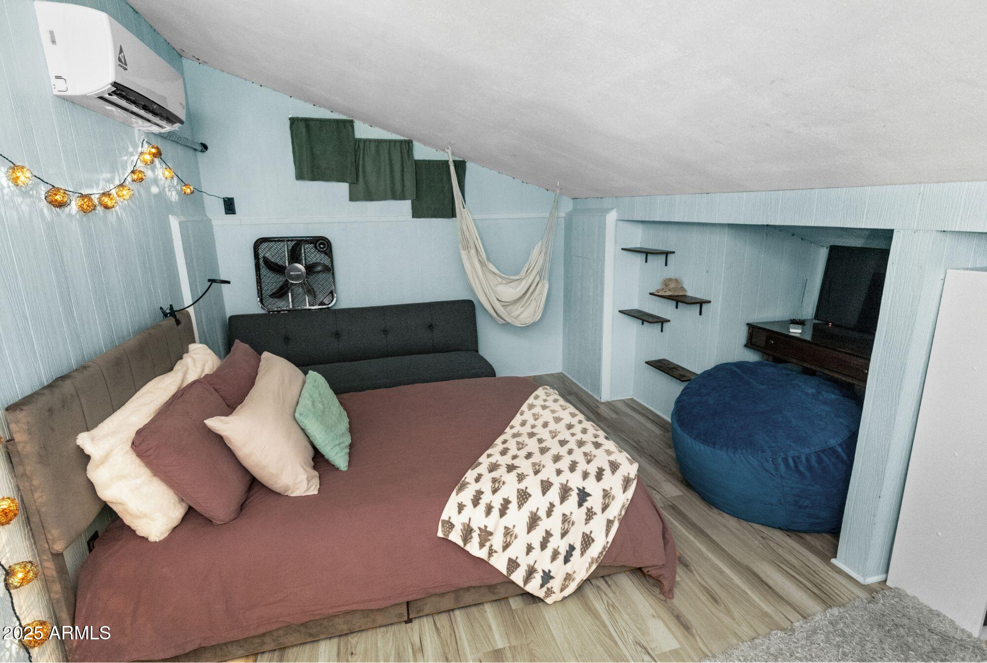 1210 East Harbor View Drive Tempe, AZ 85283 - Photo 40 of 68 a bedroom with furniture and a couch