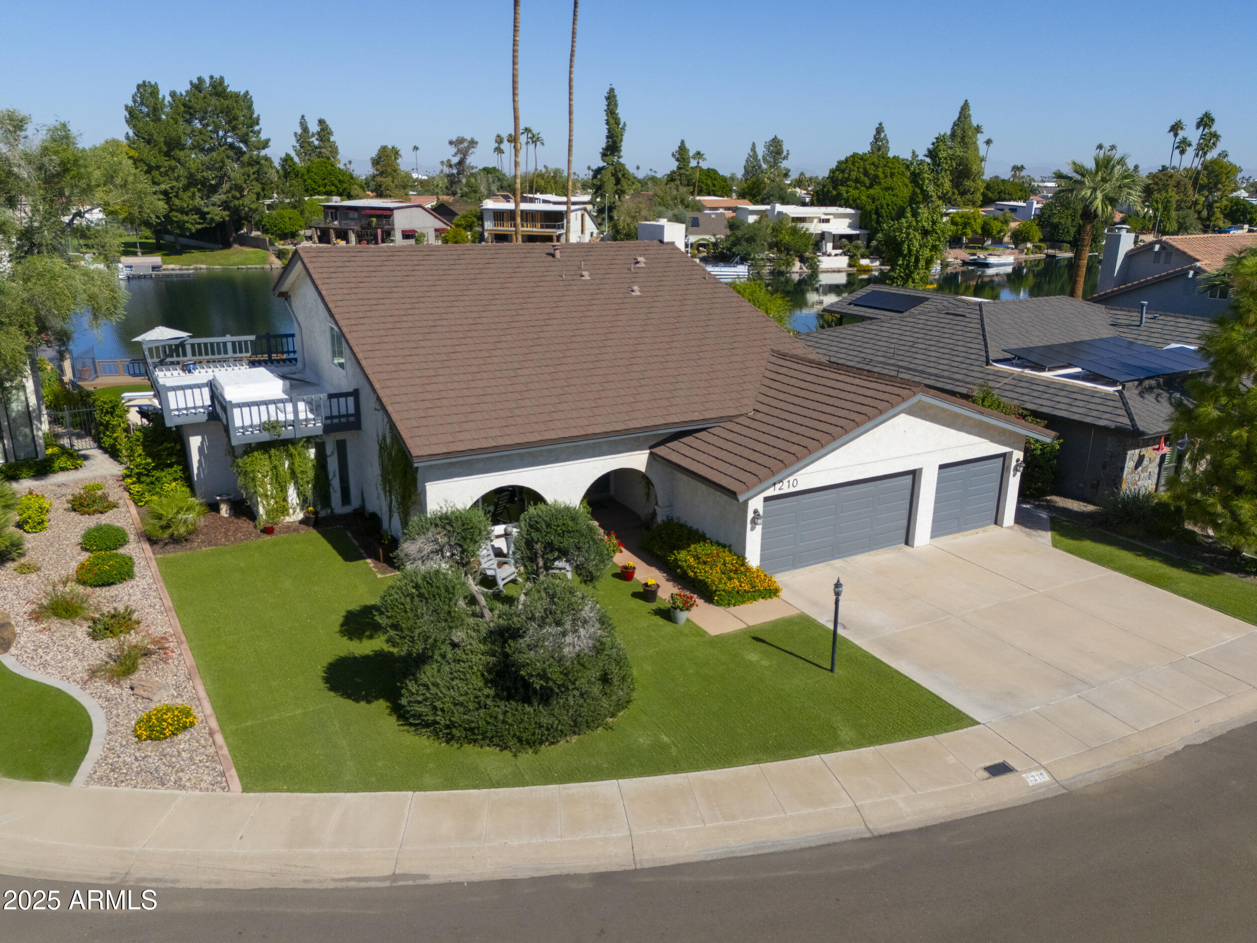1210 East Harbor View Drive Tempe, AZ 85283 - Photo 55 of 68 a aerial view of a house with swimming pool garden and patio
