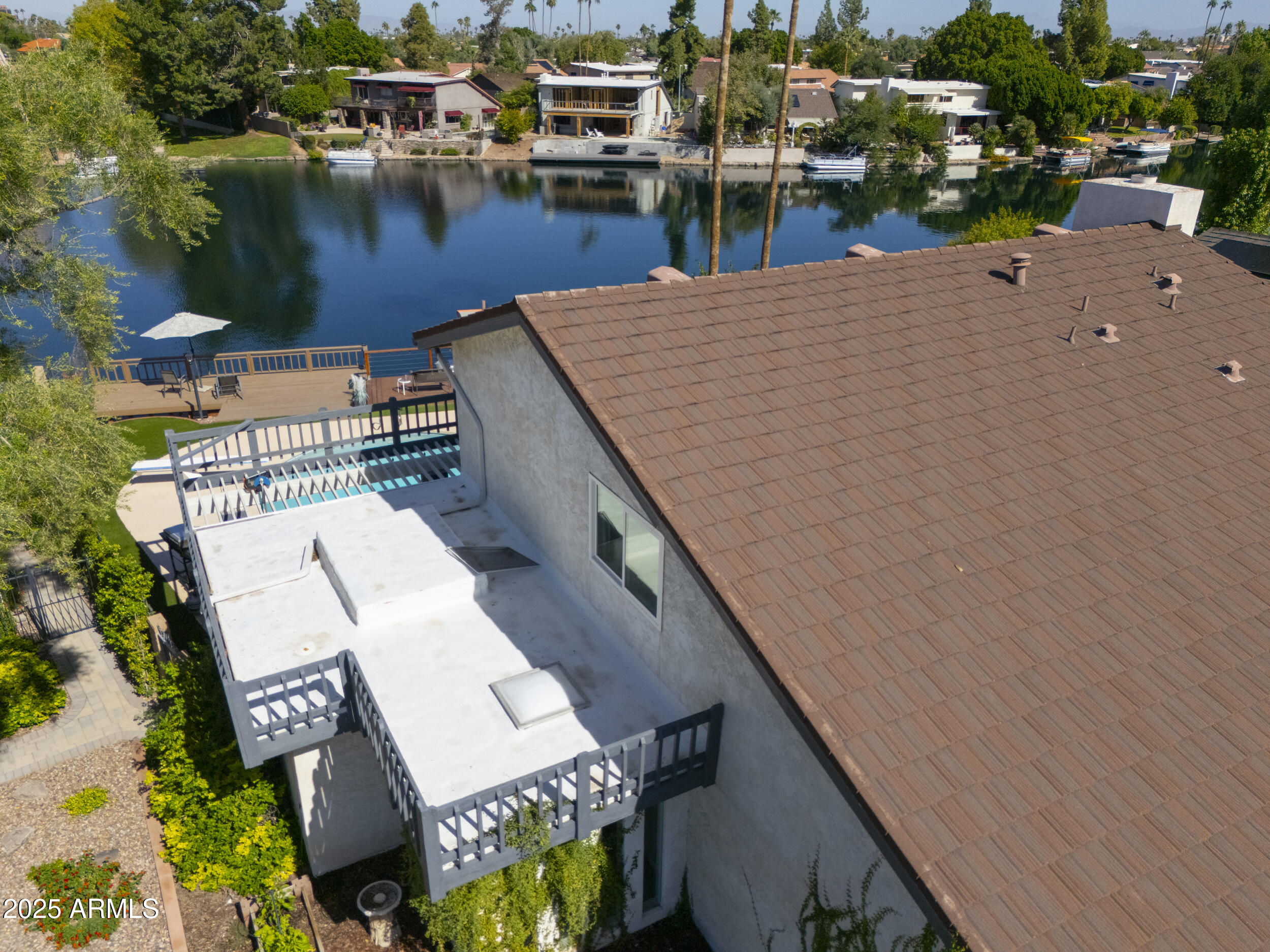 1210 East Harbor View Drive Tempe, AZ 85283 - Photo 58 of 68 a view of a lake with a terrace