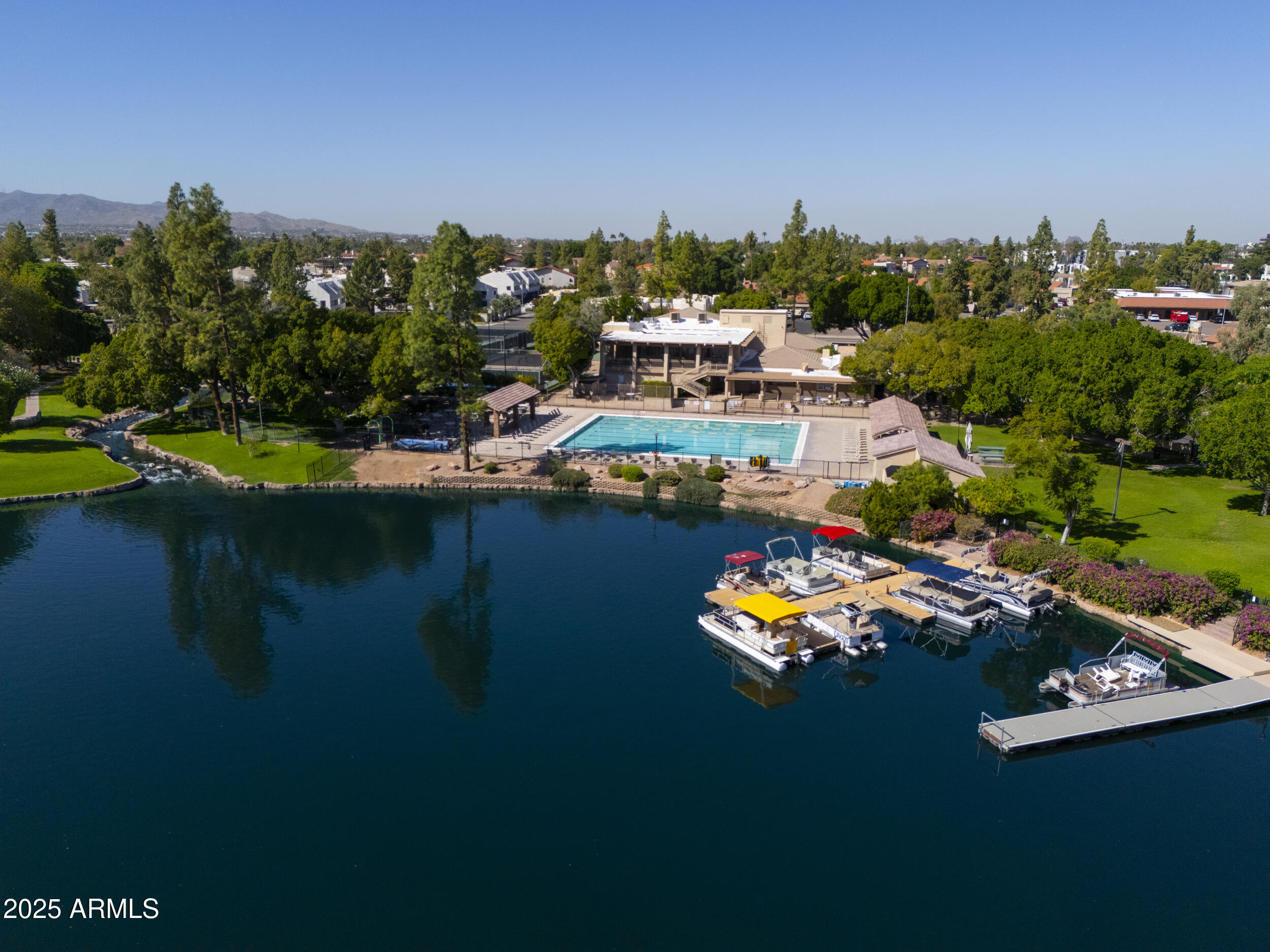 1210 East Harbor View Drive Tempe, AZ 85283 - Photo 67 of 68 a view of a lake with lawn chairs and large trees