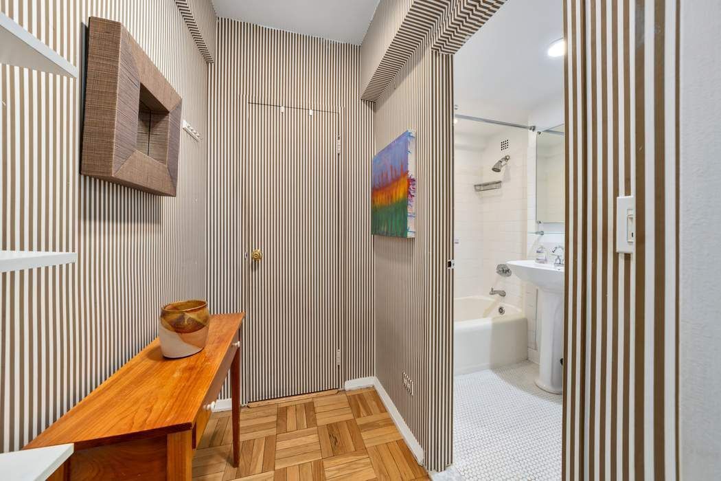 305 East 72nd Street, Unit 5AS Manhattan, NY 10021 - Photo 7 of 11 a bathroom with a toilet and a shower