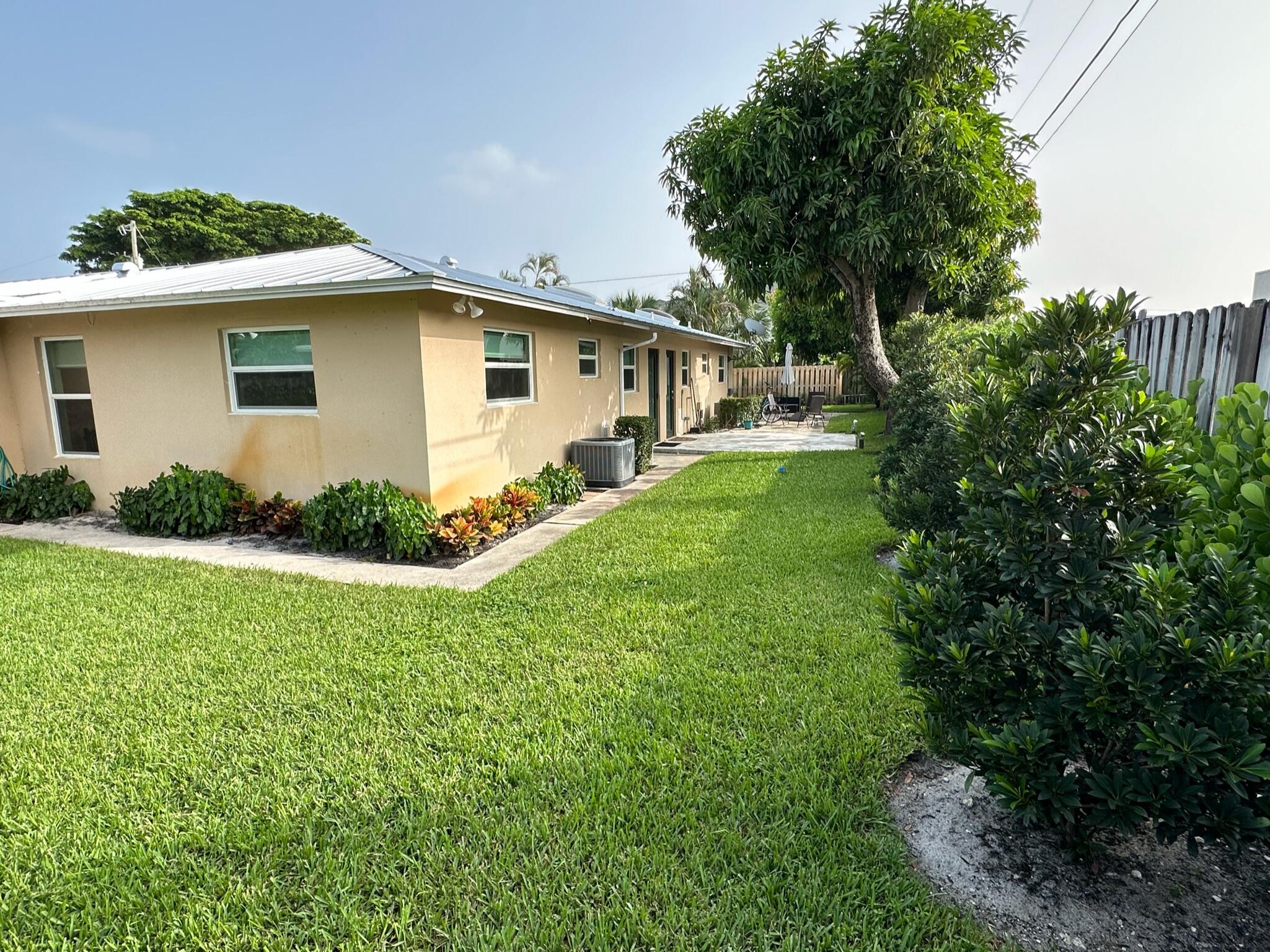 2018 Spanish Trail, Unit 2 Delray Beach, FL 33483 - Photo 5 of 13 a view of a yard of front a house