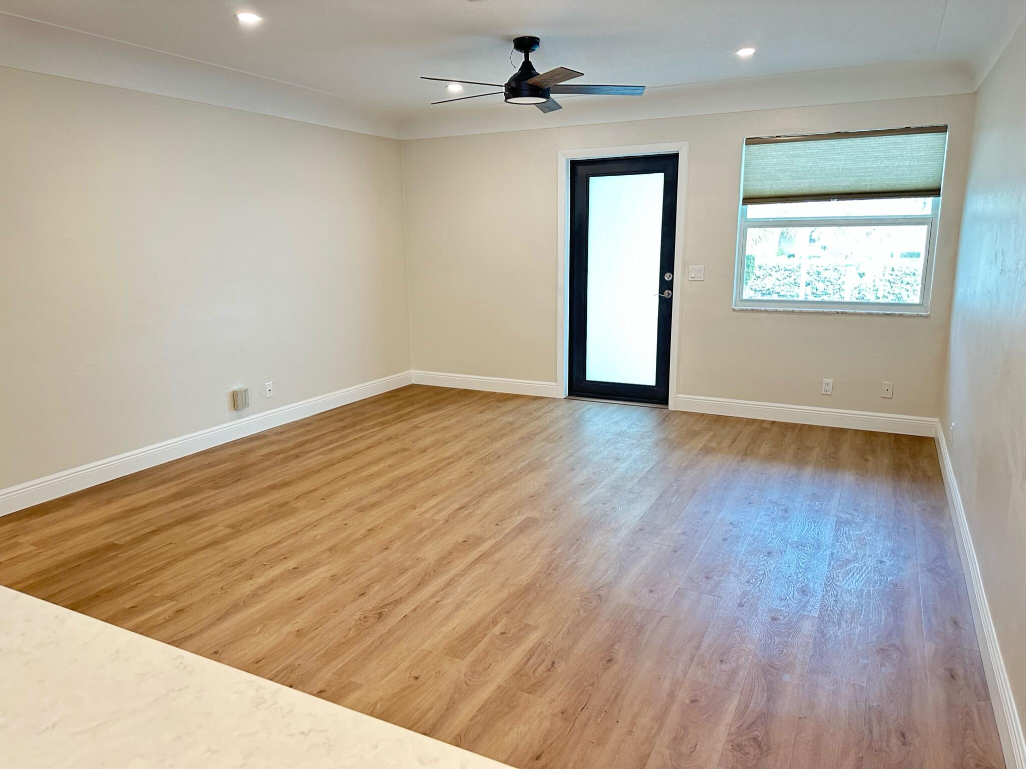 2018 Spanish Trail, Unit 2 Delray Beach, FL 33483 - Photo 6 of 13 wooden floor in an empty room with a window