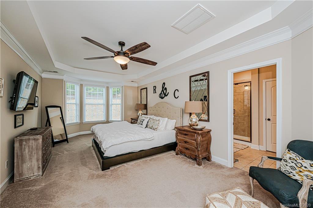 287 Annatto Way Tega Cay, SC 29708 - Photo 14 of 32 a living room with a bed furniture and a window
