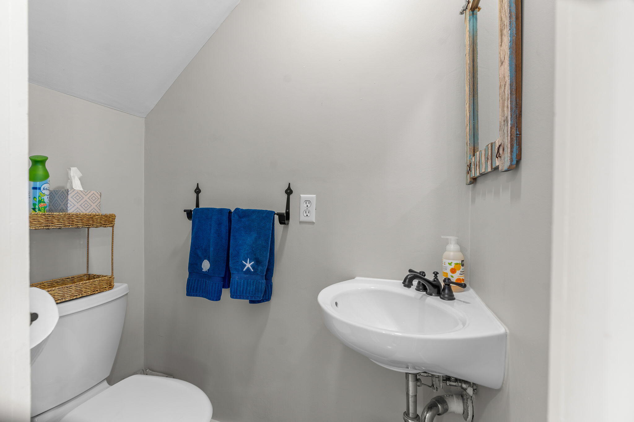 4 Race Point Road, Unit 4 Mashpee, MA 02649 - Photo 14 of 43 a bathroom with a sink a toilet and mirror