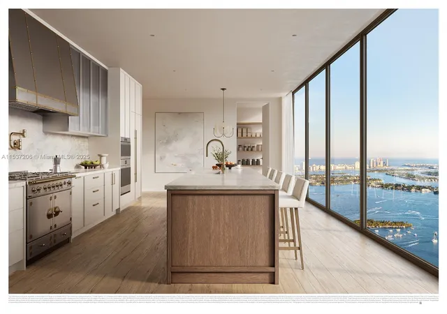 a kitchen with kitchen island a sink a stove and a refrigerator with wooden floor