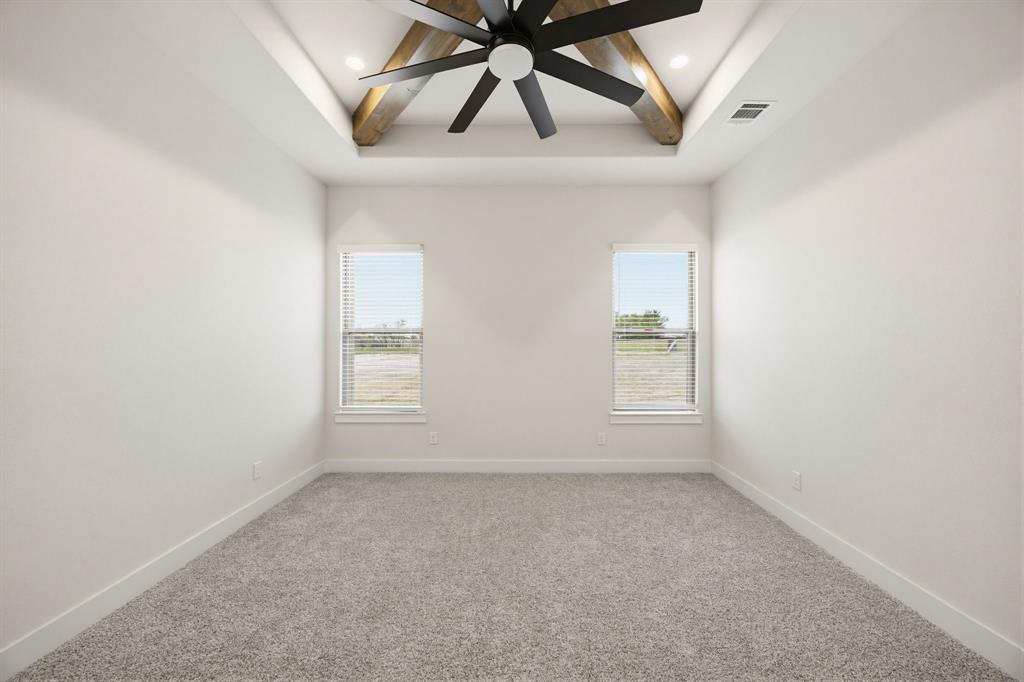 6713 Odom Road Sanger, TX 76266 - Photo 20 of 32 an empty room with windows and fan