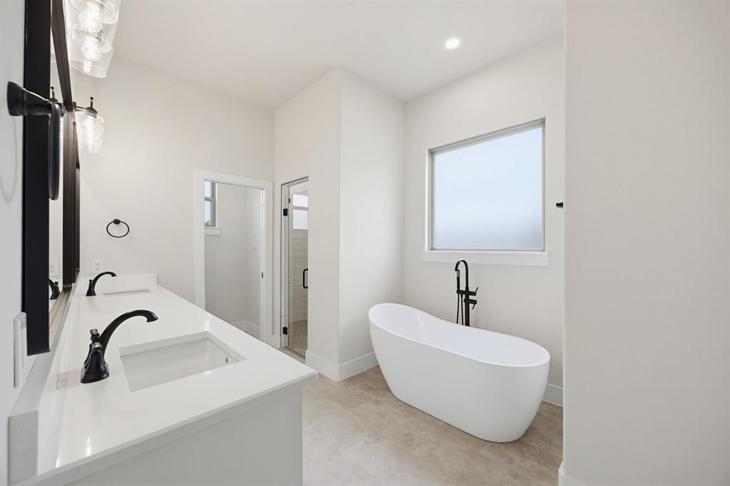 6713 Odom Road Sanger, TX 76266 - Photo 23 of 32 a bathroom with a sink and a mirror