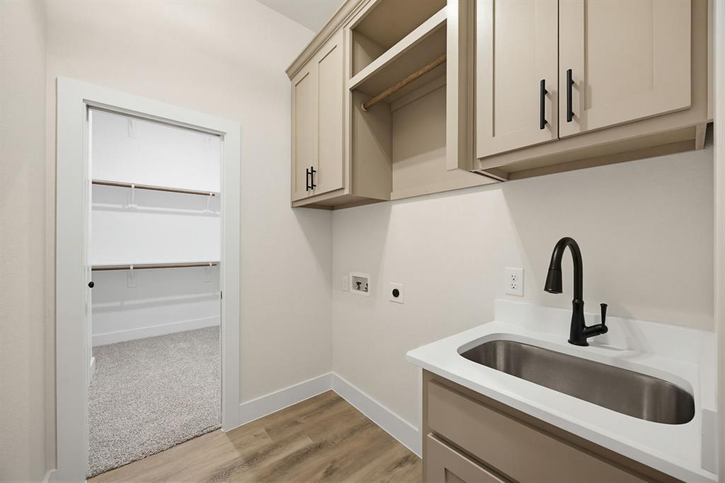 6713 Odom Road Sanger, TX 76266 - Photo 27 of 32 a close view of a sink and cabinets