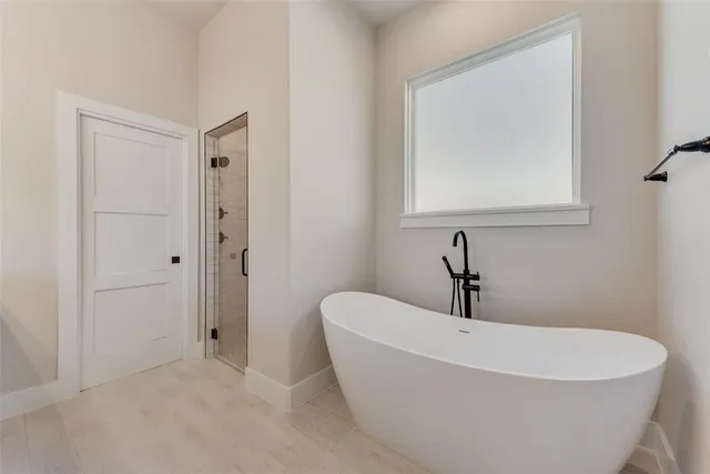 a white bath tub sitting in a bathroom