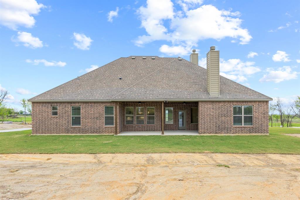 6713 Odom Road Sanger, TX 76266 - Photo 29 of 32 a front view of house with yard and green space