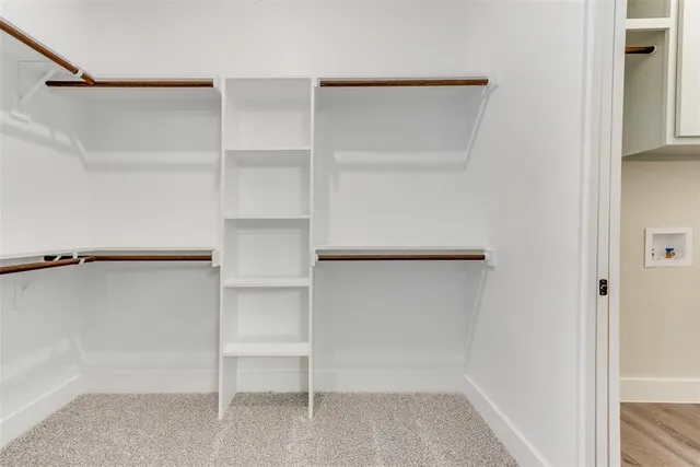 a view of an empty walk in closet