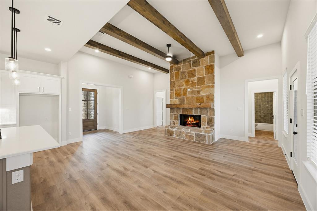 6713 Odom Road Sanger, TX 76266 - Photo 6 of 32 a view of empty room with wooden floor and fireplace