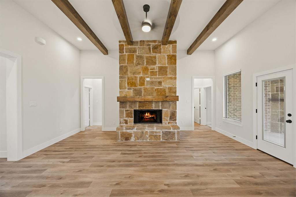6713 Odom Road Sanger, TX 76266 - Photo 9 of 32 a view of livingroom with a fireplace