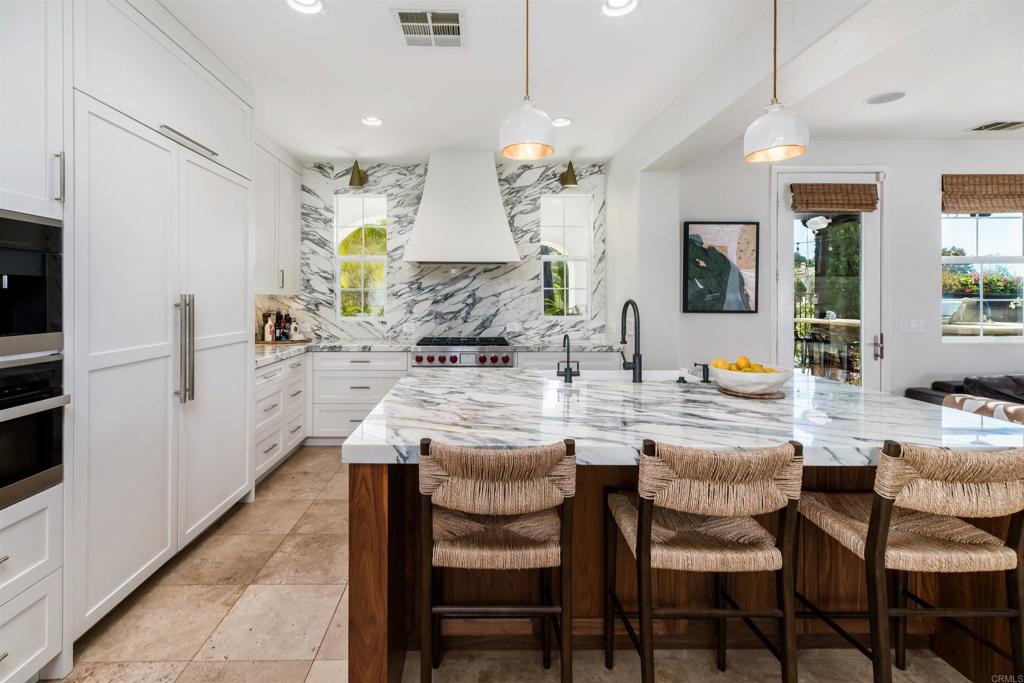 2367 Lapis Road Carlsbad, CA 92009 - Photo 13 of 58 a dining table with chairs and view kitchen
