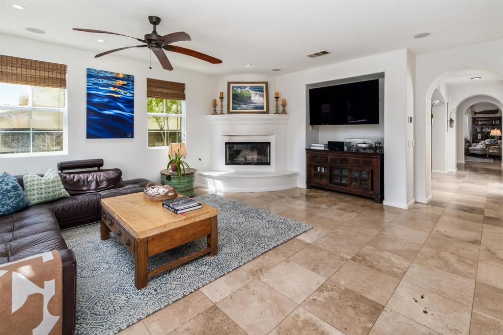 2367 Lapis Road Carlsbad, CA 92009 - Photo 20 of 58 a living room with furniture a flat screen tv and a fireplace