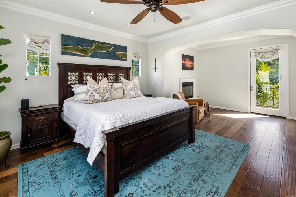 2367 Lapis Road Carlsbad, CA 92009 - Photo 24 of 58 a bedroom with a bed and wooden floor