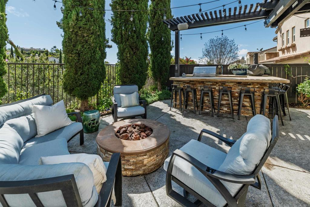 2367 Lapis Road Carlsbad, CA 92009 - Photo 39 of 58 a view of a patio with couches table and chairs and potted plants