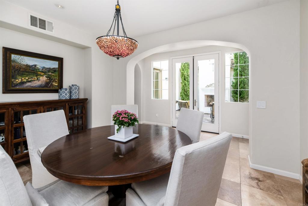 2367 Lapis Road Carlsbad, CA 92009 - Photo 9 of 58 a dining room with furniture a livingroom and chandelier