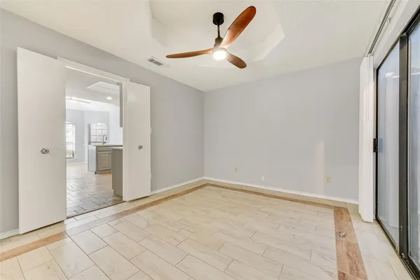 wooden floor in an empty room with a fireplace