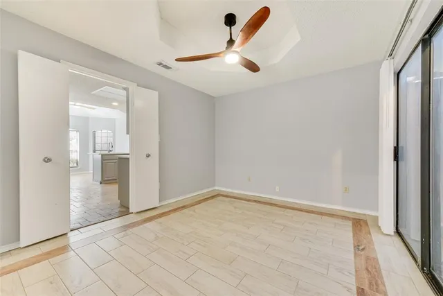wooden floor in an empty room with a fireplace